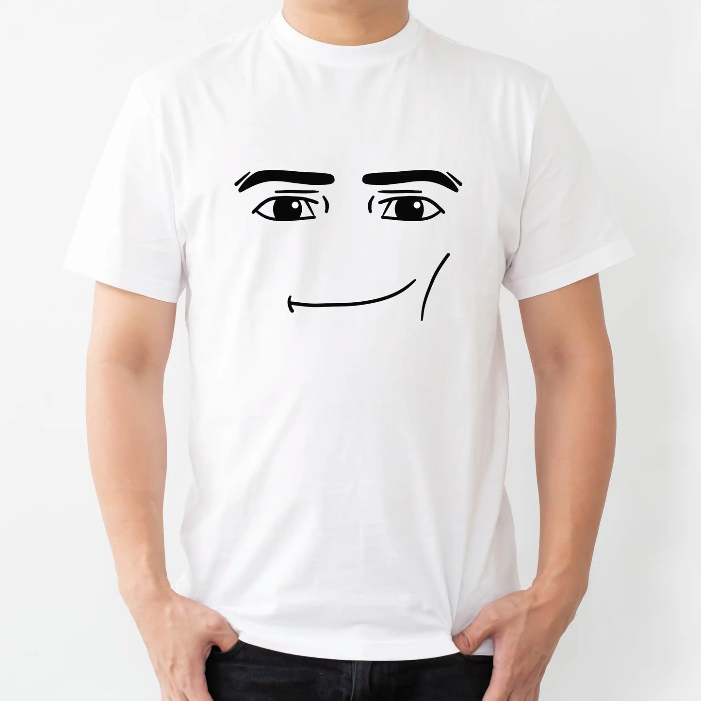 Biała koszulka z czarnym, minimalistycznym nadrukiem kultowego mema z gry, przedstawiającym twarz Roblox Man Face